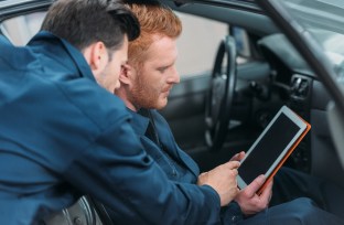 Car mechanics using digital tablet